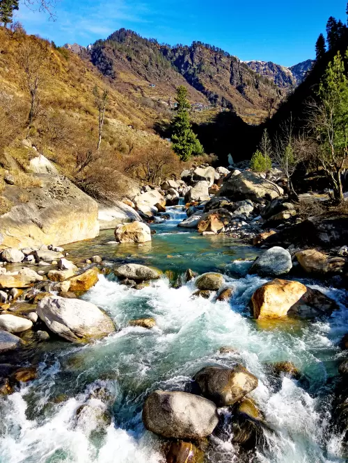 Kasol, Parvati Valley – scenic mountain river and rocky landscape featured in Himachal Pradesh tour packages