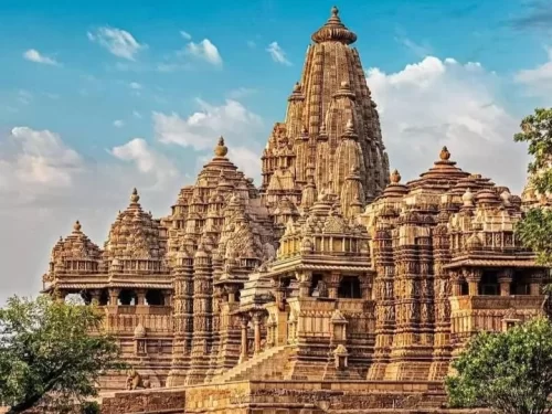 Khajuraho Temple Group in Madhya Pradesh featuring intricately carved sandstone temples under a clear blue sky, a UNESCO World Heritage Site often included in Madhya Pradesh tour packages