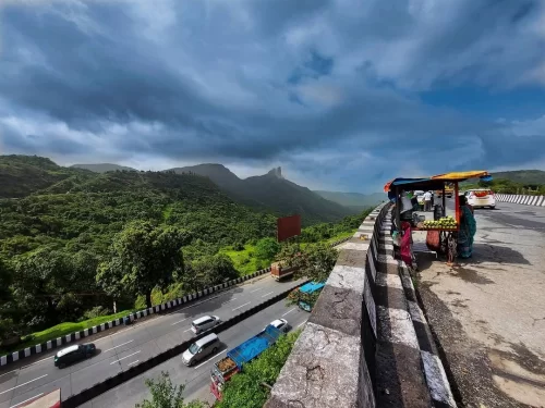 Khandala Ghat View Point. Scenic Western Ghats viewpoint with lush valleys and winding highway views near Lonavala. 