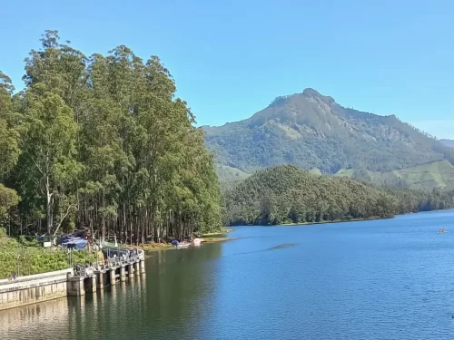 Kundala Dam in Munnar, scenic reservoir surrounded by lush hills and serene Western Ghats landscape.