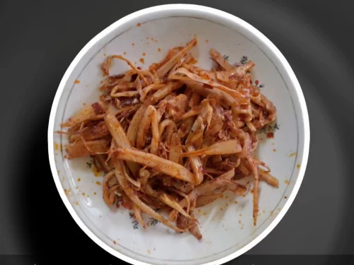 Tawang Monastery at Arunachal Pradesh during sunset, featuring the gilded Buddha statue and snow-capped peaks, adventure Arunachal Pradesh tour package.