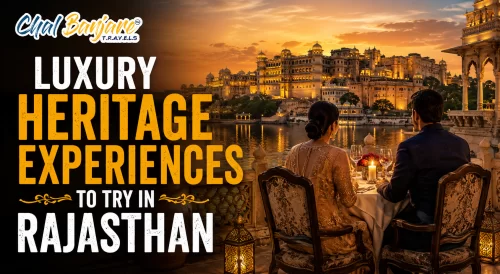 Luxury heritage experiences to try in Rajasthan travel guide featuring a couple enjoying a candlelit dinner on a balcony overlooking an illuminated lakeside palace at sunset for a rajasthan travel blog