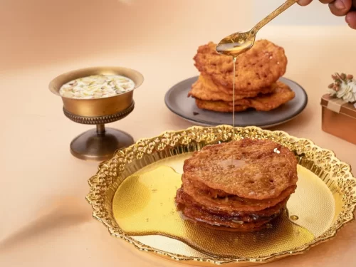 Camel safari at Jaisalmer during sunset, featuring sand dunes, perfect adventure Rajasthan tour package.