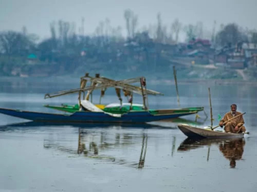 Mansabal Lake Ganderbal serene freshwater lake with traditional boats and scenic Himalayan surroundings in Kashmir