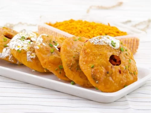 Camel safari at Jaisalmer during sunset, featuring sand dunes, perfect adventure Rajasthan tour package.