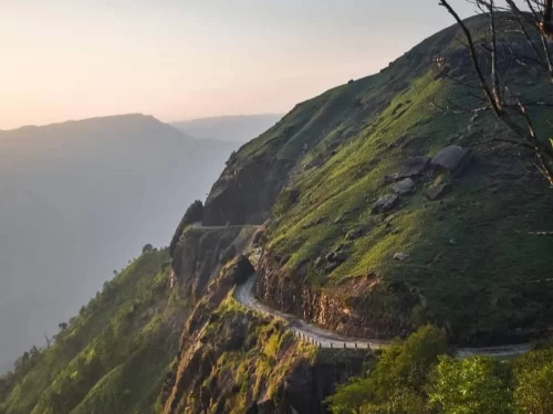 Mawsynram Hill Meghalaya scenic mountain road with lush green cliffs and panoramic valley views