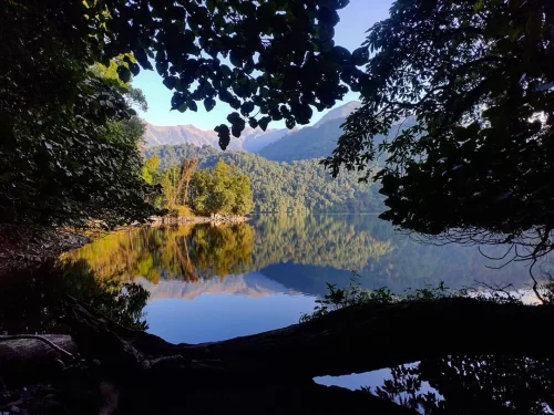 Mehao Lake tranquil freshwater lake surrounded by dense forests and scenic mountain reflections in Arunachal Pradesh Package.