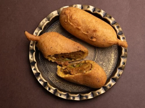 Camel safari at Jaisalmer during sunset, featuring sand dunes, perfect adventure Rajasthan tour package.