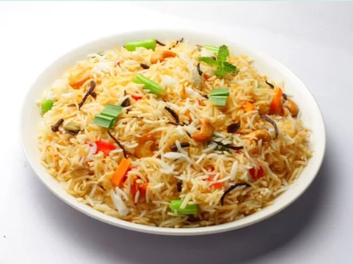 Shikara ride at Dal Lake Srinagar during sunset, featuring houseboats and mountains, romantic Srinagar tour package.