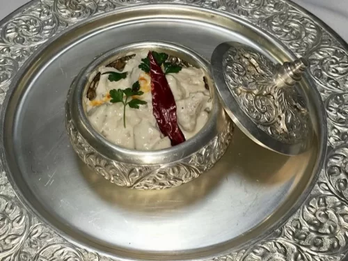 Camel safari at Jaisalmer during sunset, featuring sand dunes, perfect adventure Rajasthan tour package.