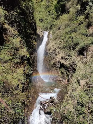 Mountain Riders Waterfall Sikkim scenic mountain waterfall with rainbow view in lush Himalayan valley