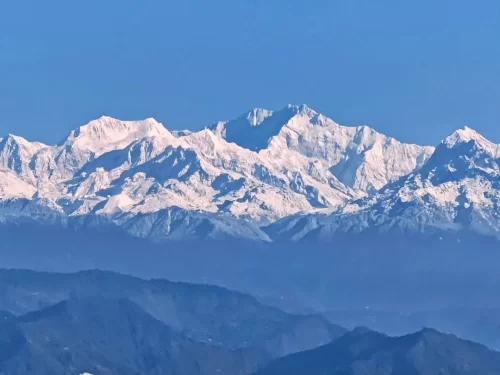 Observatory Hill View Point in Darjeeling, West Bengal, panoramic view of snow-covered Kanchenjunga peaks and layered Himalayan ranges, iconic sight featured in West Bengal tour packages