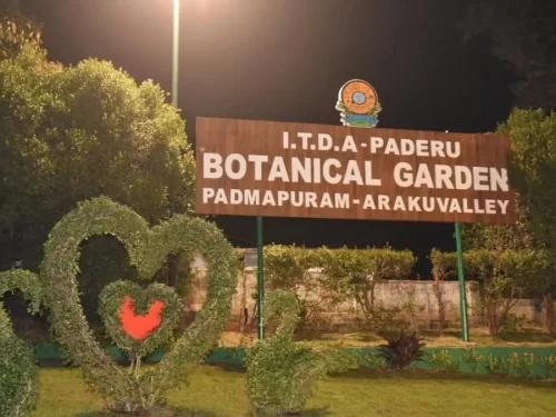 Padmapuram Botanical Gardens, Araku Valley botanical park entrance sign with lush greenery and topiary sculptures.