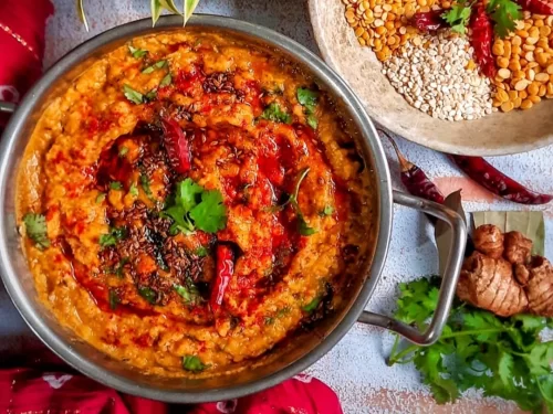 Camel safari at Jaisalmer during sunset, featuring sand dunes, perfect adventure Rajasthan tour package.