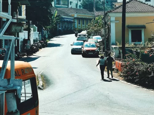 Panjim Market Goa bustling local street with shops, colonial houses and busy city road in Panaji