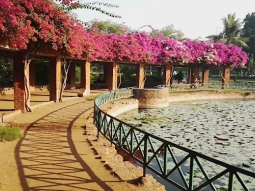Parimal Garden, beautiful landscaped park in Ahmedabad known for its serene walking paths, lush greenery, and tranquil pond surroundings.