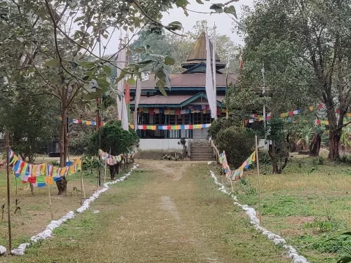Pasighat Buddhist Temple in Arunachal Pradesh with prayer flags and serene monastery setting
