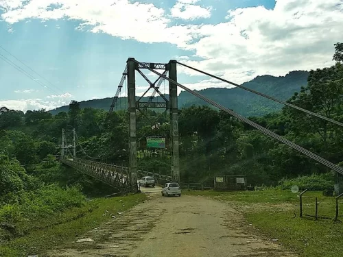 Patum Bridge historic suspension bridge connecting scenic green hills and river landscape in Arunachal Pradesh Tour Package.