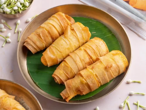 Houseboat at Alleppey backwaters during sunset, featuring palm trees and calm lagoons, romantic Kerala tour package.