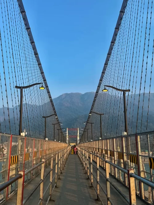 Lakshman Jhula, Rishikesh – iconic suspension bridge over Ganga featured in Uttarakhand tour packages