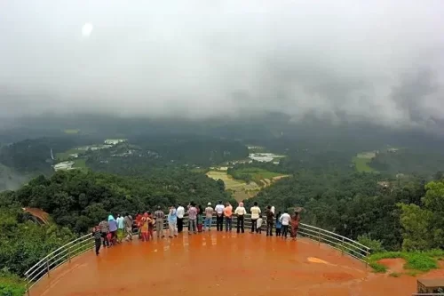 Raja's Seat Garden. Scenic valley viewpoint with misty hills and panoramic Western Ghats views in Madikeri, Coorg.