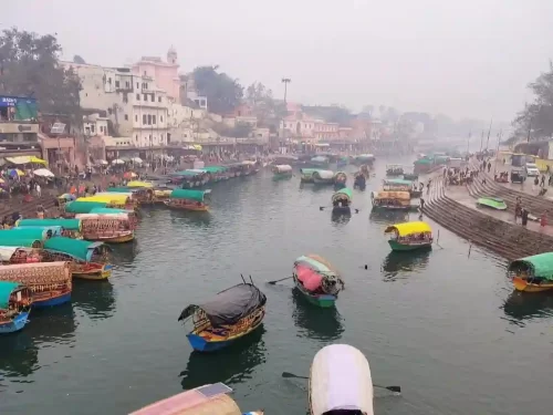Ramghat Ayodhya, vibrant riverfront ghat on the Saryu River with colorful boats, temples, and devotional atmosphere in Uttar Pradesh.