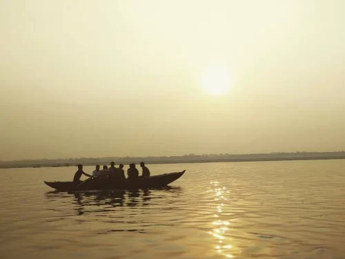 River Boating with group enjoying a peaceful sunset ride on calm waters.