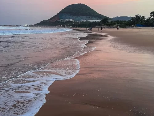 Rushikonda Beach Visakhapatnam. Popular scenic beach known for golden sands, water sports, and picturesque hill views along the Bay of Bengal.