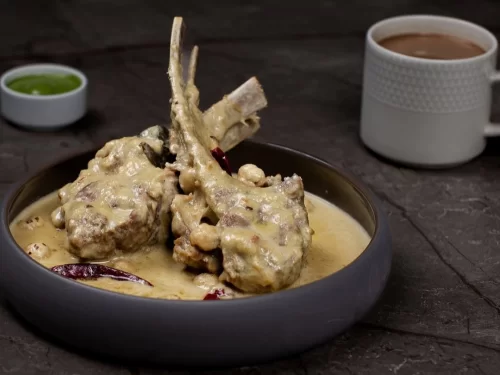 Camel safari at Jaisalmer during sunset, featuring sand dunes, perfect adventure Rajasthan tour package.