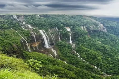 Seven Sisters Waterfall in Cherrapunji, Meghalaya, a spectacular multi-stream waterfall cascading down lush green cliffs during the monsoon season.