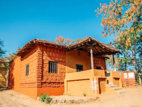 Shilpgram Udaipur Expansive 70-acre rural arts and crafts complex featuring traditional terracotta huts and stone dwellings representing Western Indian tribal life Rajasthan.