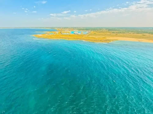 Shivrajpur Beach Dwarka, Blue Flag beach in Gujarat, pristine Arabian Sea coastline and popular tourist destination in India.