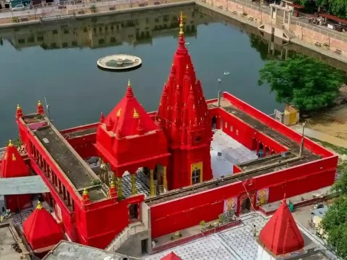 Shree Durga Mata Mandir Varanasi, iconic red temple dedicated to Goddess Durga near Durga Kund with sacred pond and spiritual ambiance in Uttar Pradesh.