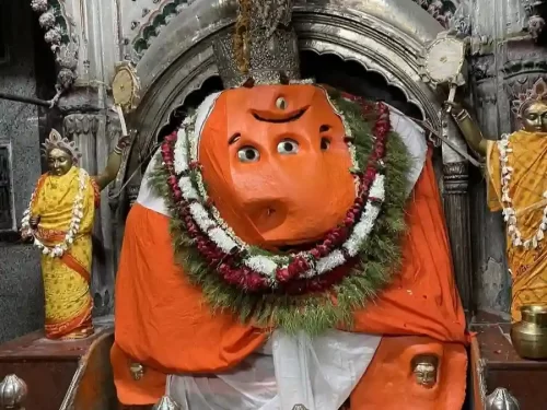Shri Bada Ganesh Mandir Varanasi, sacred temple featuring vibrant idol of Lord Ganesha adorned with garlands and spiritual ambiance in Uttar Pradesh.