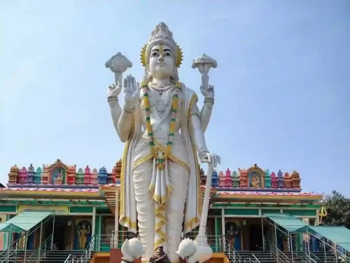 Shri Naimishnath Vishnu Temple Naimisharanya, sacred Hindu temple featuring towering Lord Vishnu statue and vibrant spiritual ambiance in Uttar Pradesh. 