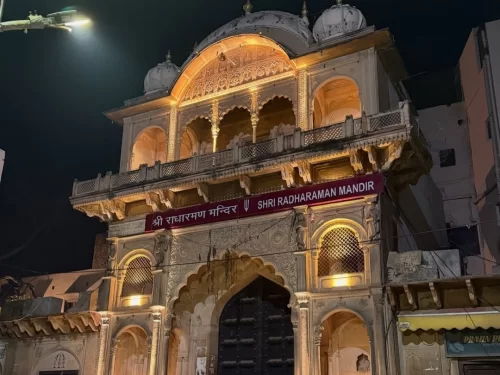 Shri Radha Raman Temple Vrindavan illuminated marble facade at night, famous Krishna temple Uttar Pradesh