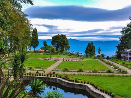Shrubbery Nightingale Park in Darjeeling, West Bengal, landscaped garden with circular plaza, green lawns, and Himalayan mountain views, scenic highlight included in West Bengal tour packages