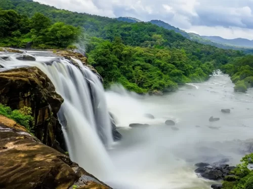 Siruvani Waterfall scenic cascades of white water surrounded by dense green forests and the Siruvani reservoir in Coimbatore.