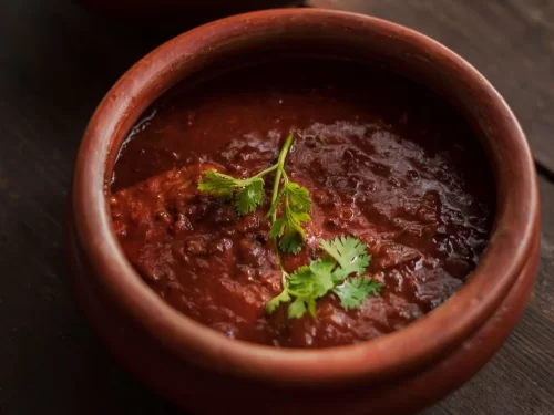 Sorpotel is a fiery Goan delicacy of slow-cooked pork simmered in tangy vinegar, aromatic spices, and rich masala, delivering bold, deep flavors in every bite.