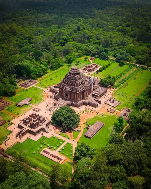 Aerial view of Konark Sun Temple complex in Odisha surrounded by lush greenery showcasing architectural heritage in Odisha tour packages