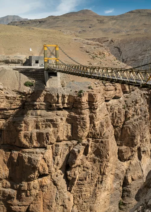 Spiti Valley suspension bridge over rugged canyon featured in Himachal Pradesh tour packages