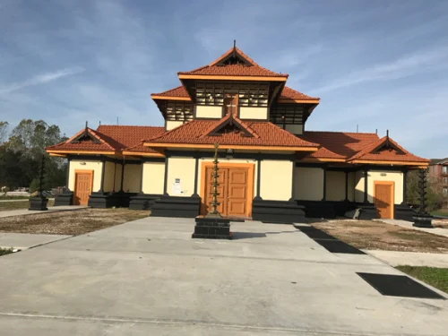 Sree Guruvayurappan Temple in Guruvayur during daylight, featuring traditional Kerala temple architecture and intricate wooden carvings, perfect spiritual experience, Kerala tour packages. 
