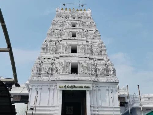 Sri Veera Venkata Sathyanarayana Swamy Vari Temple Annavaram majestic white gopuram in Andhra Pradesh tour packages. 
