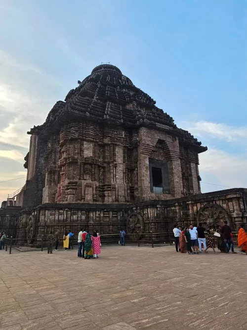 Historic Konark Sun Temple in Odisha with intricate stone carvings and ancient architecture attracting visitors through Odisha tour packages