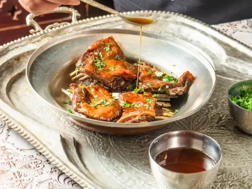 Tabak Maaz is a royal Kashmiri delicacy of tender lamb ribs simmered in aromatic spices and milk, then crisp-fried to golden perfection with rich, smoky flavors.