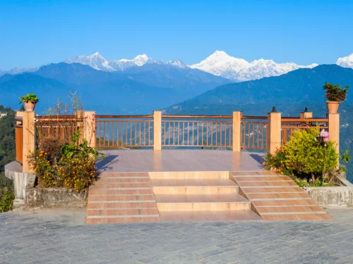Tashi View Point Gangtok during clear skies, featuring Kanchenjunga mountain views terrace platform, perfect scenic sunrise experience Sikkim tour pack