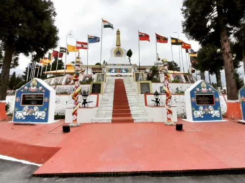 Tawang War Memorial majestic white stupa honoring brave soldiers amid scenic mountain surroundings in Arunachal Pradesh tour Package.