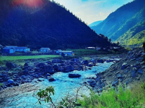 Tenga Valley scenic mountain landscape with a flowing river and charming village homes in Arunachal Pradesh Tour Package.