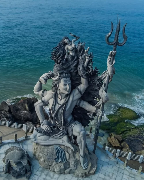 Majestic Shiva statue overlooking the Arabian Sea at Kovalam Beach, Kerala, a stunning coastal attraction featured in Kerala tour packages.
