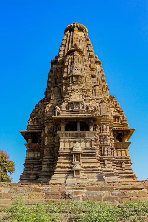 Khajuraho Jain Temple featuring intricate sandstone carvings and classic Nagara style architecture showcasing the rich heritage of Khajuraho temple tours and Madhya Pradesh cultural travel packages